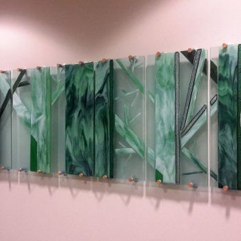 16 - 12”X 30” panels<br>
Fused glass<br>
Liberty Mutual, Floor 3, Dover, NH<br>Part of a commissioned series highlighting <br>the New Hampshire ecosystems<br>
Artists: Caroline Parent,
Dr. Kathleen Kimball
