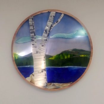 48" Diameter<br>
Raised fused glass, LED luminous micro spot features, latex, acrylic, and custom birch ring frame enclosure<br>
Medical Building<br>
Portsmouth, NH<br>
Artist: Caroline Parent 2020